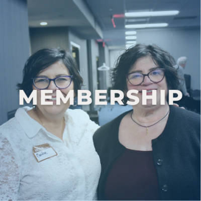 Two women standing together, smiling at the camera. Image reads, "MEMBERSHIP"